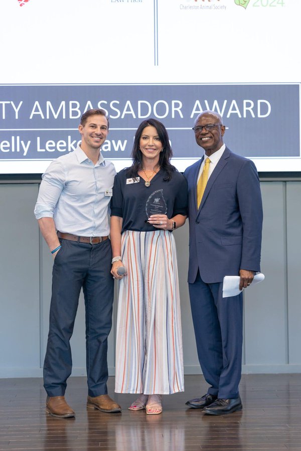 Copy-of-board-members-brantley-meier-and-don-smth-give-community-ambassador-award-to-shelly-leeke-scaled.jpg